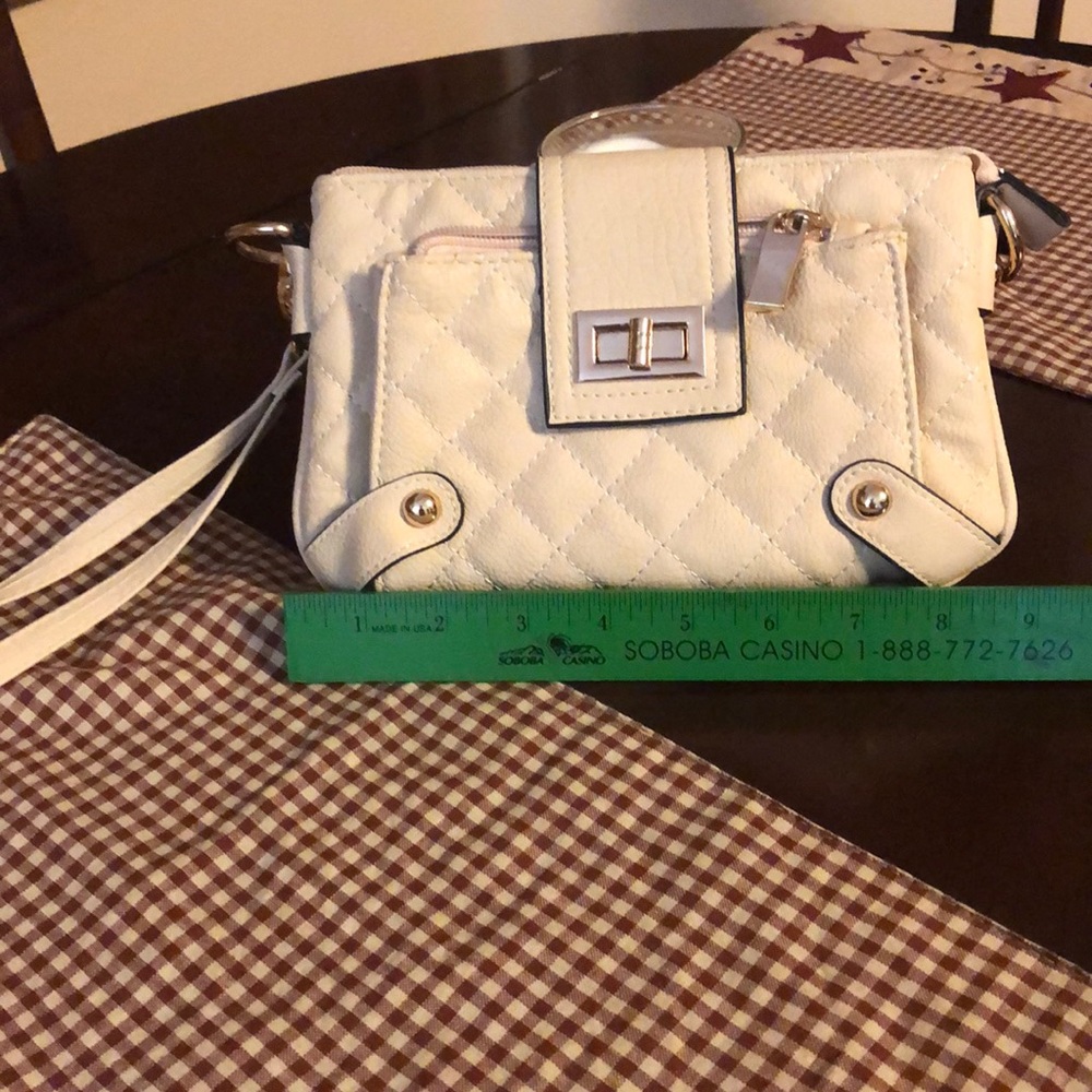 Cute quilted wristlet. Off white